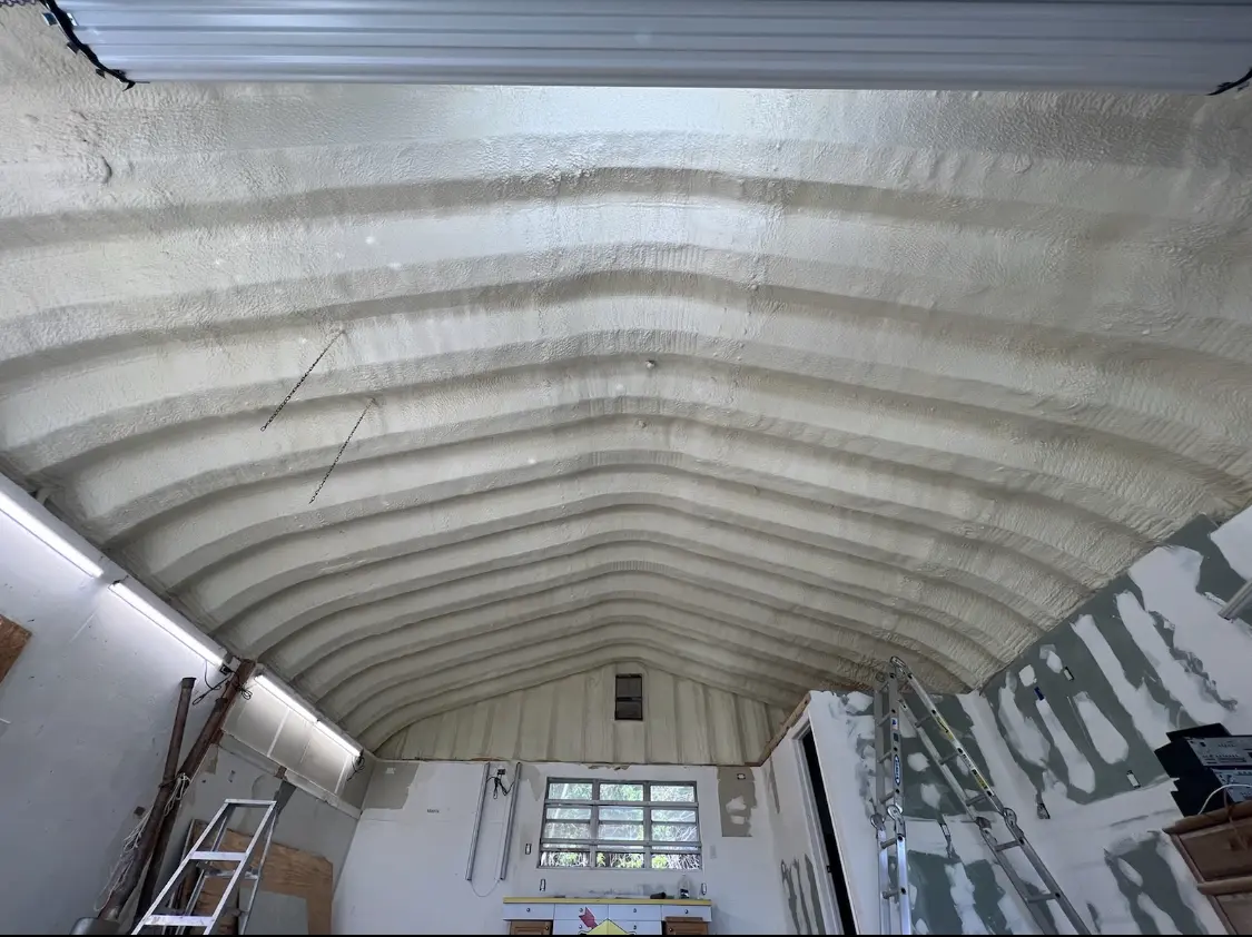 Spray polyurethane foam applied to the underside of a metal roof deck in Cheverly